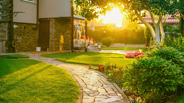 Beautiful landscaping in front of a house, frontyard landscaping of suburban home.