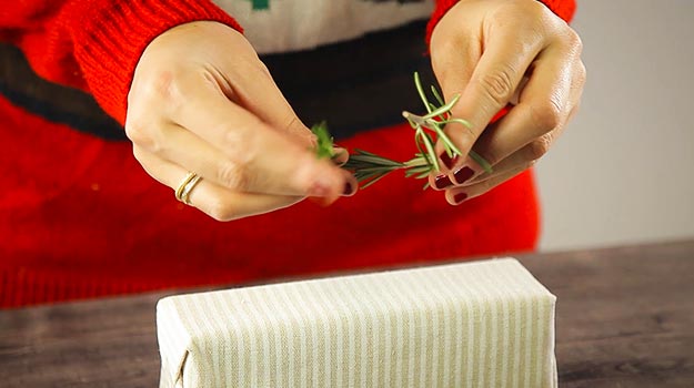 Make a wreath with the sprig of rosemary. Attach both ends together with wire. 