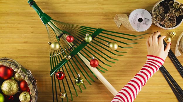 Glue Christmas tree ball ornaments on the rake using a hot glue gun.