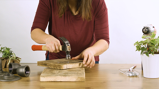 Fix the frame hanger at the back of the wood board