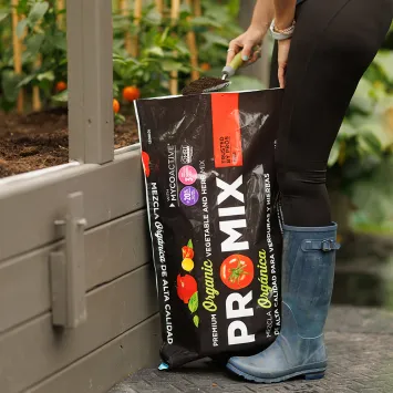 pro-mix-vegetables-and-herbs-mix-pouring-mix-in-garden