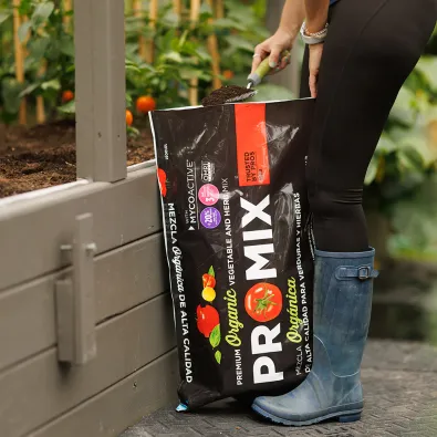 pro-mix-vegetables-and-herbs-mix-pouring-mix-in-garden